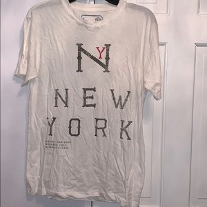 White shirt sleeved tee shirt with New York design